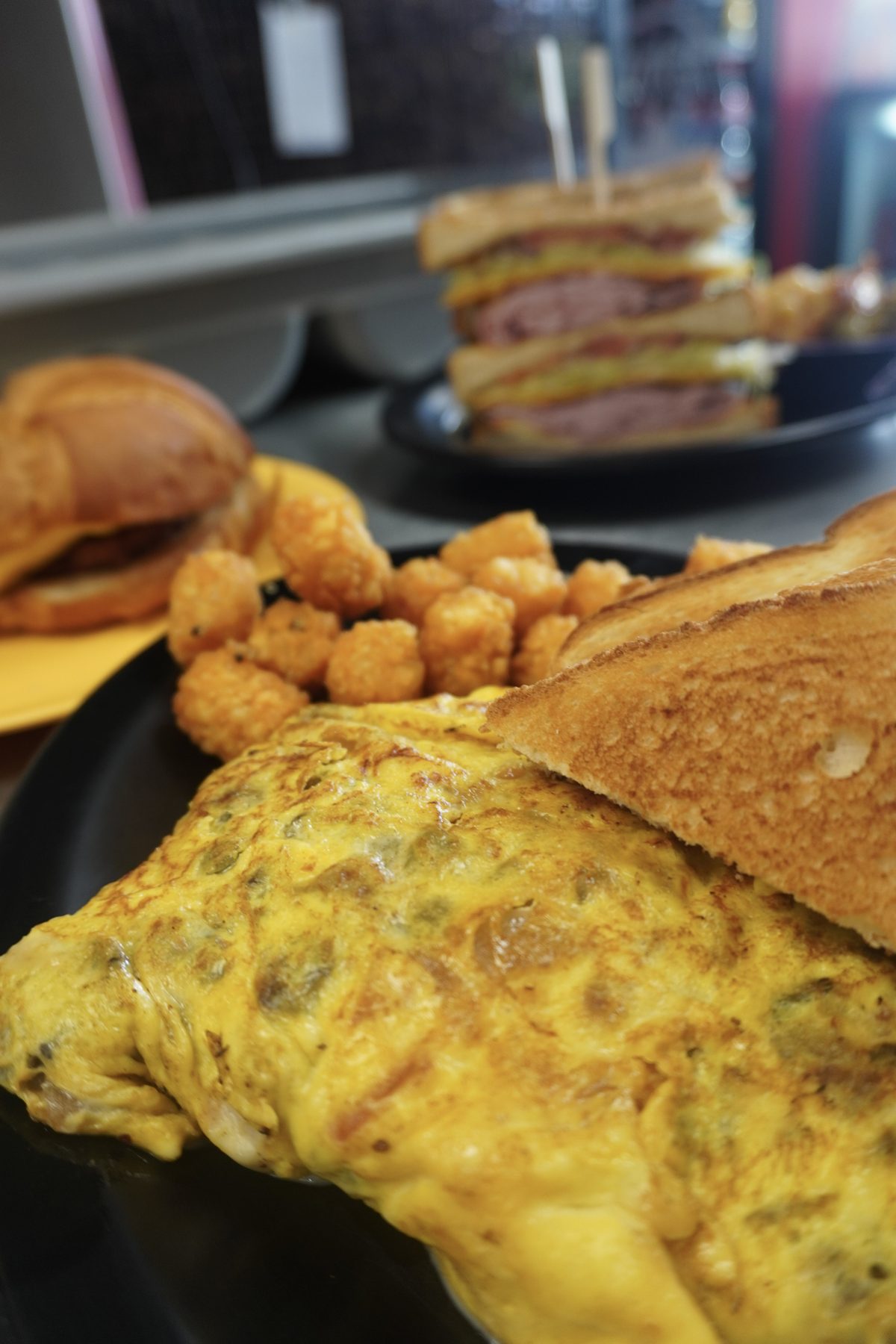 Omelette platter with tots and toast at Sak's Deli