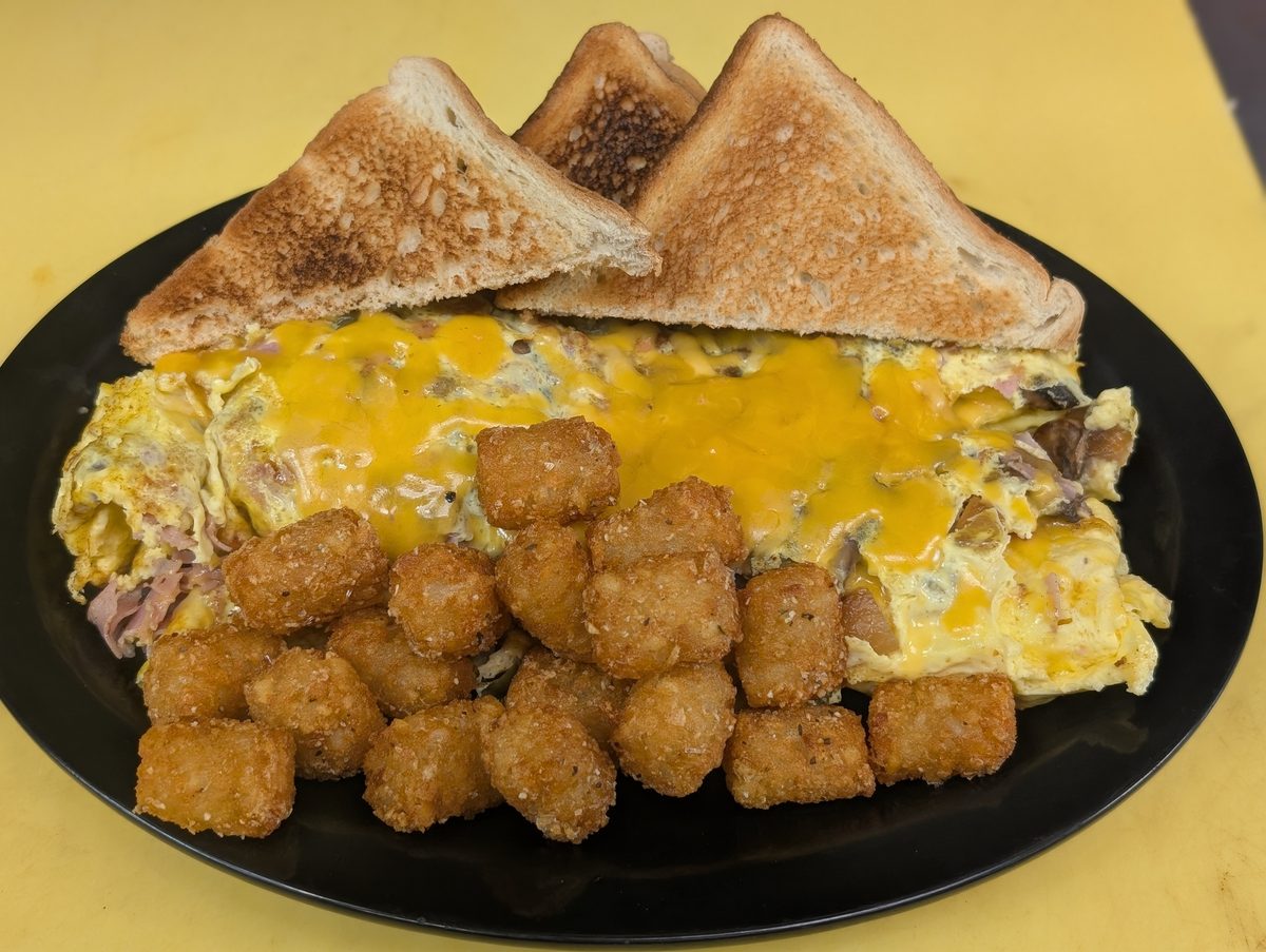 Cheese omelette with tots and toast at Sak's Deli