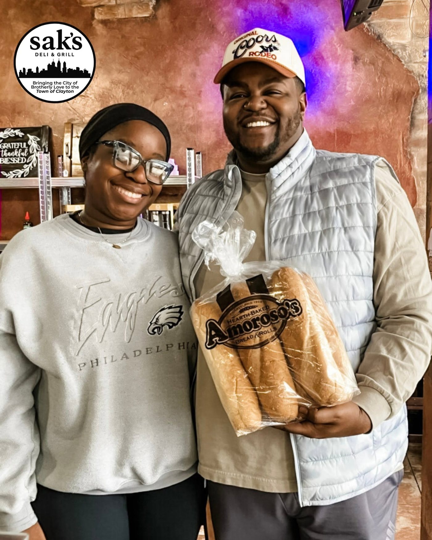 Customers grabbing Amoroso rolls at Sak's Deli in Clayton NC